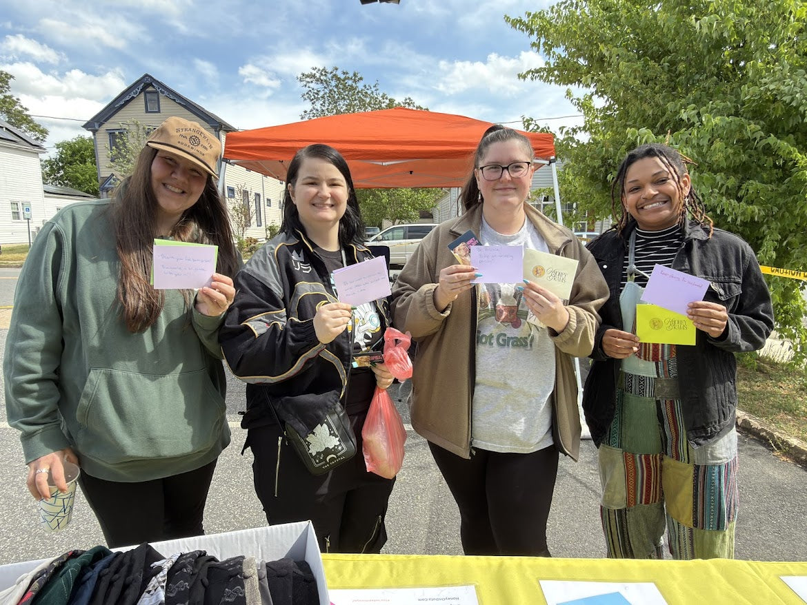 Community advocacy — people holding signs at Honey on Duty event